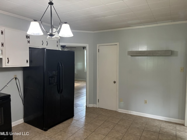 232 Renfroe Rd, Canton, MS 39046 - kitchen with black appliances, white cabinets, light tile patterned flooring, crown molding, and decorative light fixtures