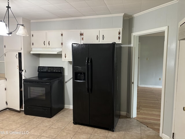 232 Renfroe Rd, Canton, MS 39046 - kitchen with black appliances, under cabinet range hood, ornamental molding, white cabinets, and light tile patterned floors