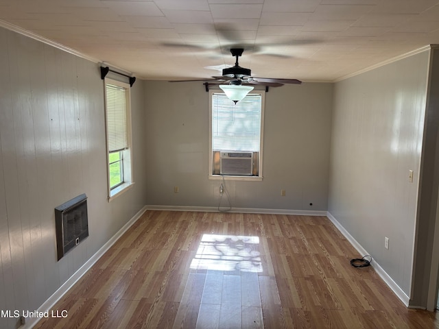 232 Renfroe Rd, Canton, MS 39046 - empty room featuring a ceiling fan, cooling unit, wood finished floors, ornamental molding, and heating unit