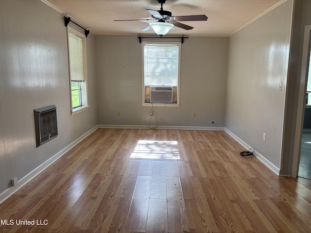 232 Renfroe Rd, Canton, MS 39046 - empty room featuring heating unit, cooling unit, wood finished floors, ceiling fan, and crown molding