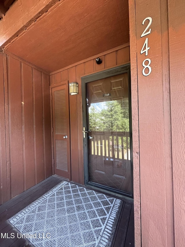 248 Lakeside Villa Unit J, Diamondhead, MS 39525 - property entrance with board and batten siding