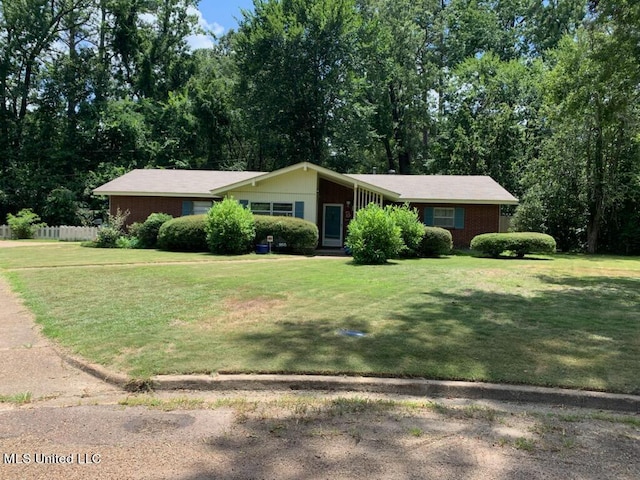 ranch-style house with a front yard