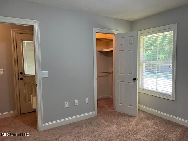 104 Blackstone Cir, Brandon, MS 39047 - unfurnished bedroom with carpet floors, a spacious closet, and a closet
