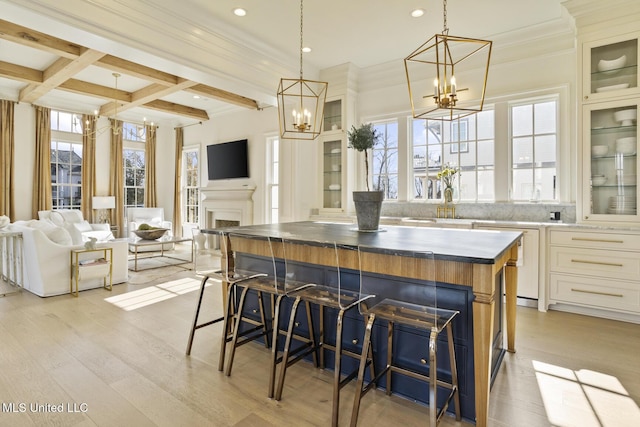 kitchen with a large island, hanging light fixtures, and a chandelier