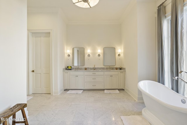 bathroom featuring crown molding, a tub, and vanity