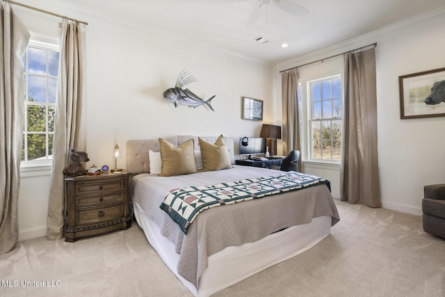 carpeted bedroom featuring multiple windows, ornamental molding, and ceiling fan