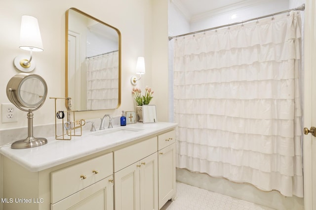 bathroom featuring vanity and ornamental molding