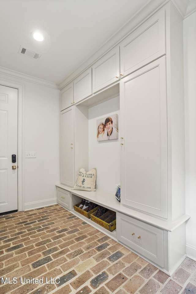 mudroom featuring ornamental molding