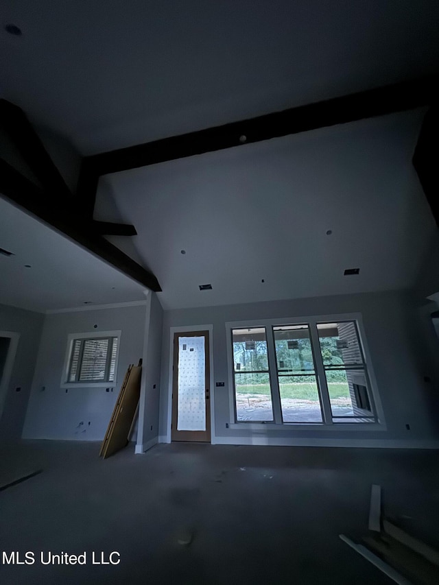 interior space featuring visible vents, carpet floors, and vaulted ceiling