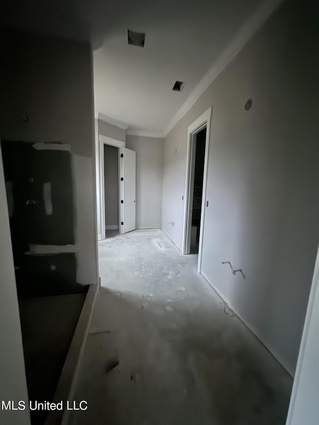 hallway featuring ornamental molding