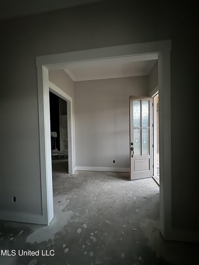 empty room featuring baseboards