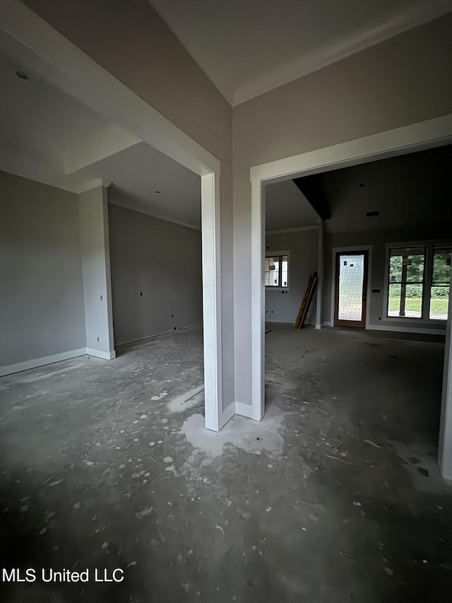 unfurnished room featuring baseboards