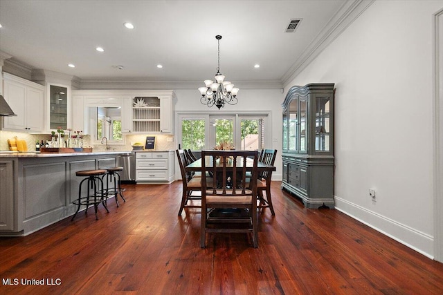 2003 Canterbury Pl W, Brandon, MS 39042 - dining space featuring a chandelier, ornamental molding, dark wood-type flooring, recessed lighting, and baseboards