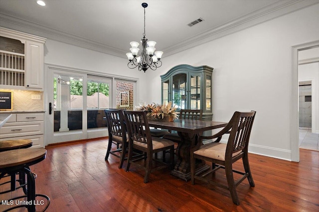 2003 Canterbury Pl W, Brandon, MS 39042 - dining room with dark wood-type flooring, a chandelier, ornamental molding, recessed lighting, and baseboards
