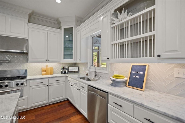 2003 Canterbury Pl W, Brandon, MS 39042 - kitchen with a sink, stainless steel dishwasher, white cabinetry, extractor fan, and glass insert cabinets