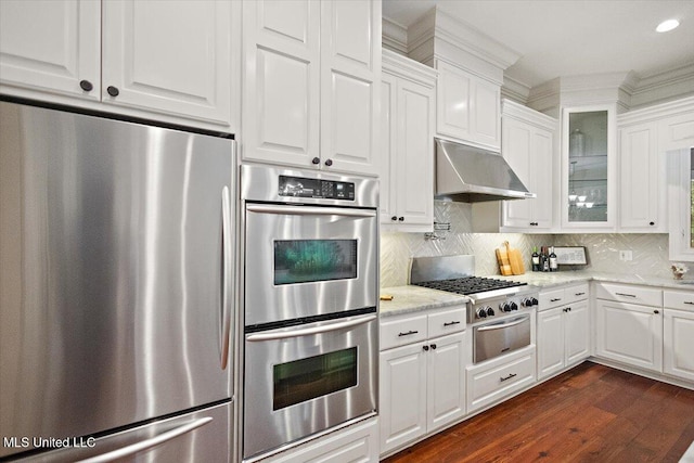 2003 Canterbury Pl W, Brandon, MS 39042 - kitchen featuring stainless steel appliances, white cabinetry, a warming drawer, glass insert cabinets, and extractor fan