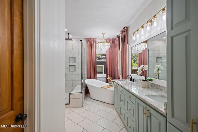 2003 Canterbury Pl W, Brandon, MS 39042 - bathroom featuring a chandelier, a stall shower, double vanity, a freestanding tub, and marble finish flooring