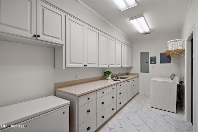2003 Canterbury Pl W, Brandon, MS 39042 - laundry room with cabinet space, electric panel, light marble finish floors, crown molding, and independent washer and dryer