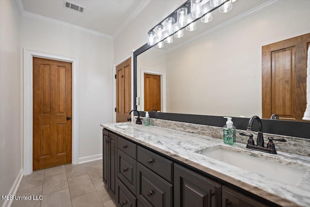 2003 Canterbury Pl W, Brandon, MS 39042 - bathroom featuring baseboards, double vanity, crown molding, and tile patterned flooring