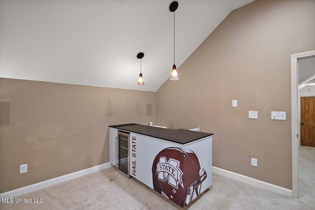 2003 Canterbury Pl W, Brandon, MS 39042 - kitchen featuring lofted ceiling, light carpet, pendant lighting, baseboards, and dark countertops