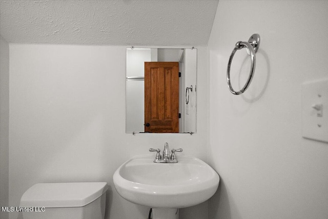 2003 Canterbury Pl W, Brandon, MS 39042 - bathroom with a textured ceiling, a sink, and toilet
