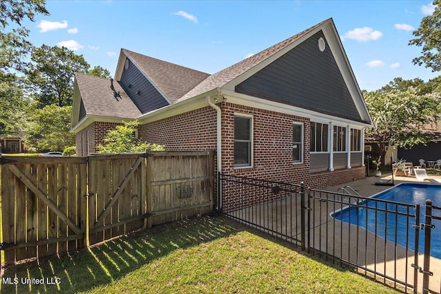 2003 Canterbury Pl W, Brandon, MS 39042 - rear view of house with brick siding, roof with shingles, a gate, and a patio area