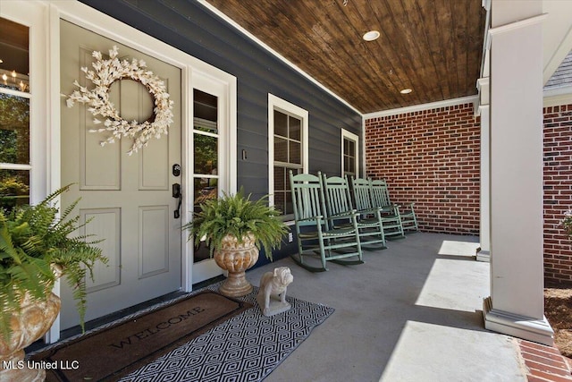 2003 Canterbury Pl W, Brandon, MS 39042 - doorway to property with a porch and brick siding