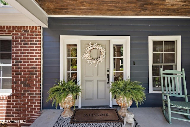 2003 Canterbury Pl W, Brandon, MS 39042 - doorway to property with brick siding and a porch