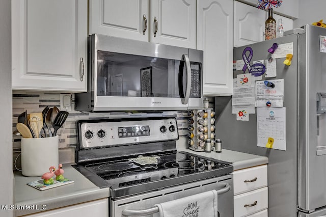 kitchen featuring white cabinetry, tasteful backsplash, and appliances with stainless steel finishes