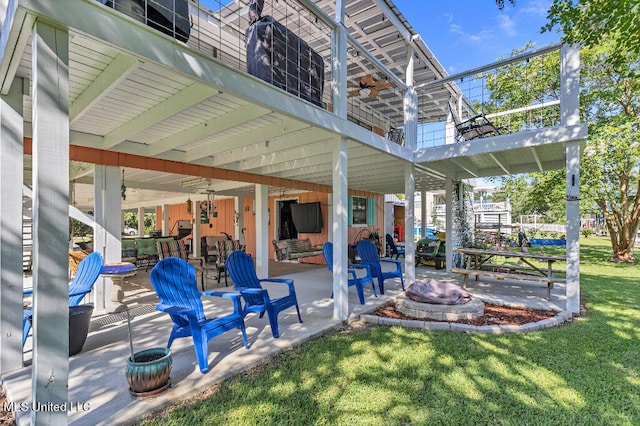 view of patio / terrace featuring an outdoor fire pit and ceiling fan