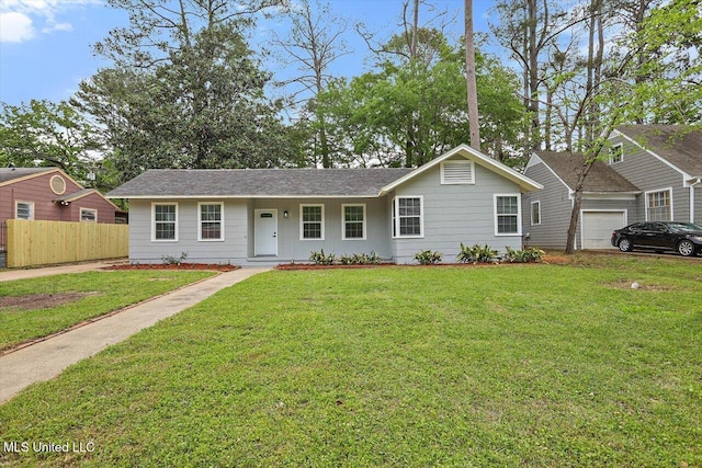 4560 Meadowridge Dr, Jackson, MS 39206 - ranch-style home with a front lawn and fence