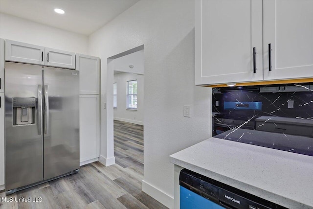 4560 Meadowridge Dr, Jackson, MS 39206 - kitchen with stainless steel fridge with ice dispenser, dishwashing machine, light wood-type flooring, and decorative backsplash