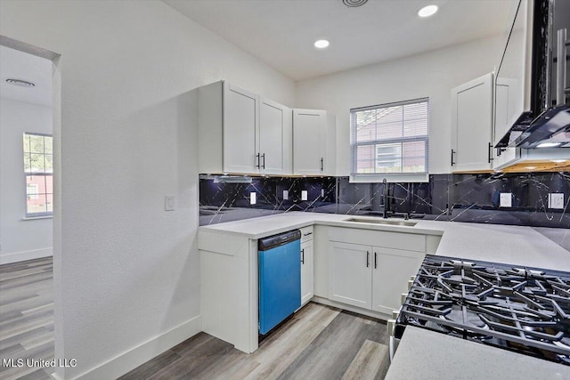 4560 Meadowridge Dr, Jackson, MS 39206 - kitchen featuring a sink, stainless steel gas range, a wealth of natural light, and dishwashing machine