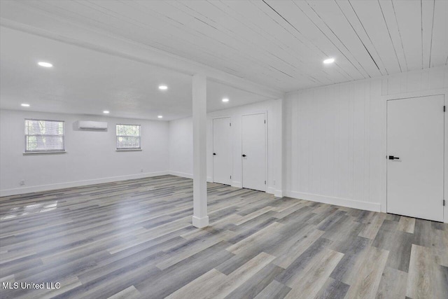 4560 Meadowridge Dr, Jackson, MS 39206 - basement with an AC wall unit, baseboards, recessed lighting, and wood finished floors