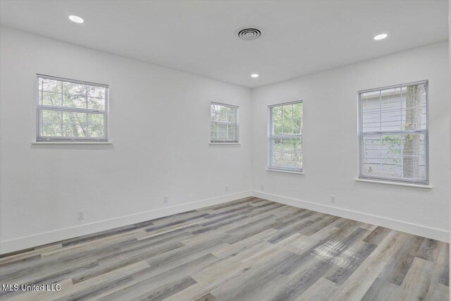 4560 Meadowridge Dr, Jackson, MS 39206 - unfurnished room with light wood-type flooring, baseboards, and recessed lighting