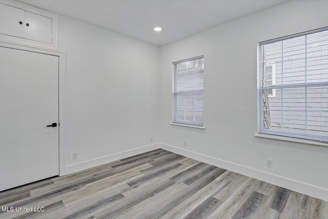 4560 Meadowridge Dr, Jackson, MS 39206 - spare room featuring recessed lighting, baseboards, and wood finished floors