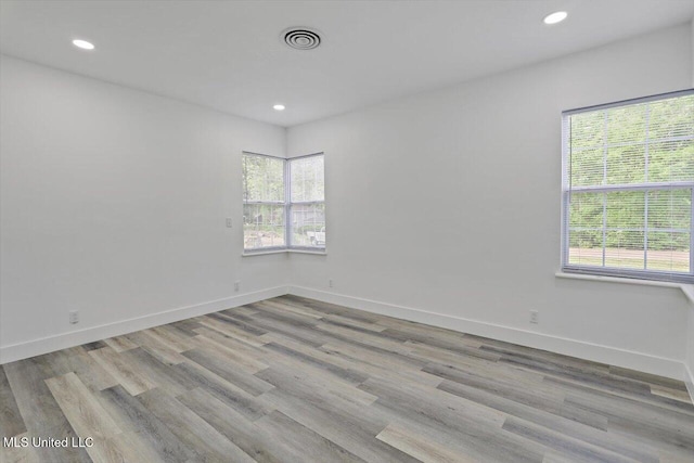 4560 Meadowridge Dr, Jackson, MS 39206 - unfurnished room with visible vents, baseboards, recessed lighting, and wood finished floors