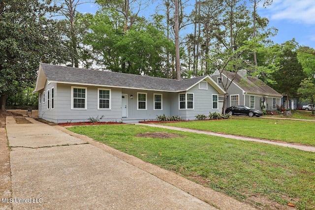 4560 Meadowridge Dr, Jackson, MS 39206 - ranch-style home with a front lawn, a shingled roof, and concrete driveway