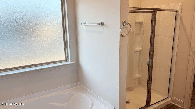 bathroom with independent shower and bath