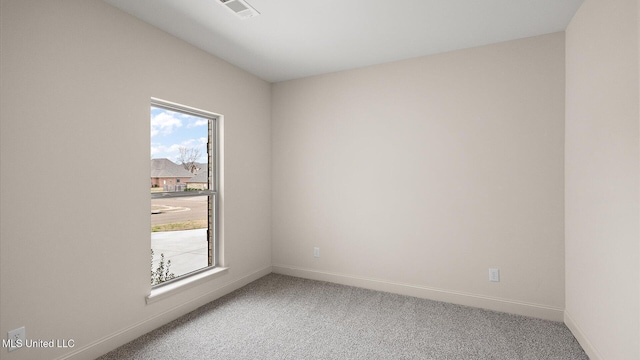 unfurnished room with carpet flooring