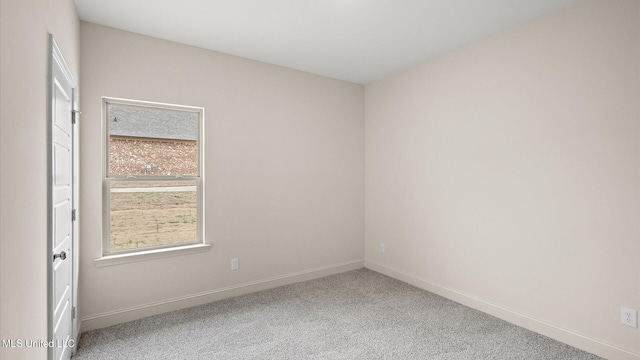 spare room featuring carpet flooring