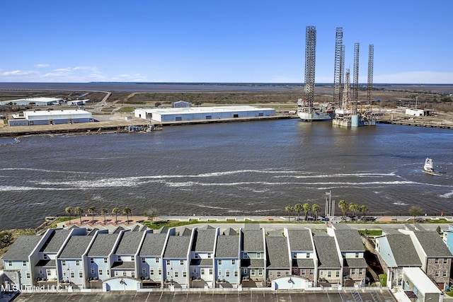 birds eye view of property featuring a water view and a residential view