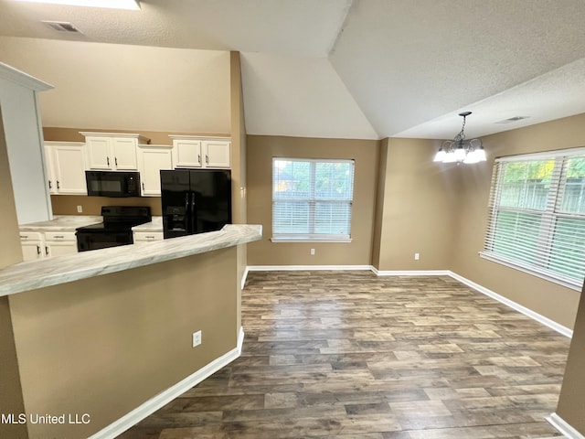 kitchen with black appliances, lofted ceiling, white cabinets, dark wood-style flooring, and baseboards