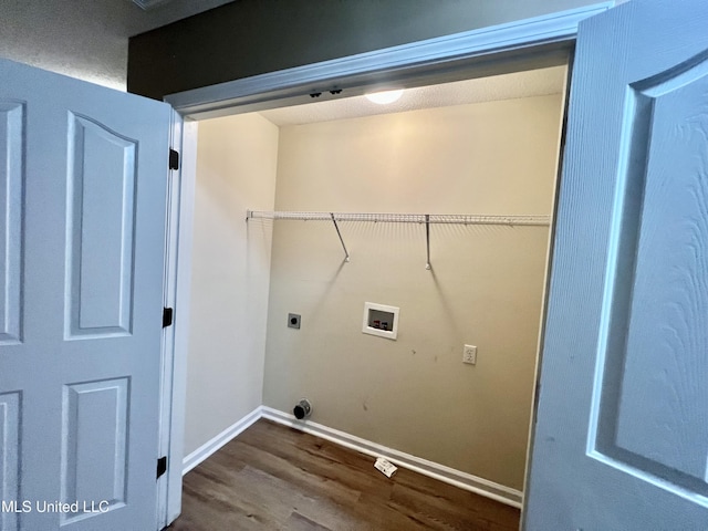washroom with washer hookup, dark wood-type flooring, hookup for an electric dryer, and baseboards