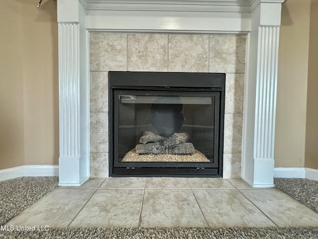 detailed view of a fireplace and baseboards