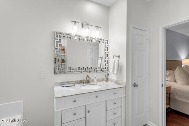 2252 Beach Dr Unit 206, Gulfport, MS 39507 - ensuite bathroom with vanity and wood finished floors