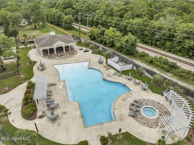 2252 Beach Dr Unit 206, Gulfport, MS 39507 - community pool with a patio area, a forest view, and an outdoor structure