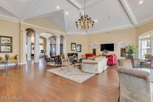 2252 Beach Dr Unit 206, Gulfport, MS 39507 - living area with ornate columns, high vaulted ceiling, beamed ceiling, wood finished floors, and a chandelier