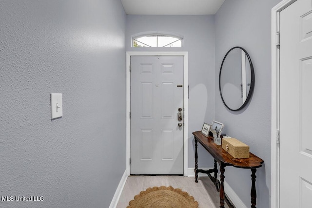 2252 Beach Dr Unit 206, Gulfport, MS 39507 - doorway to outside featuring light wood-type flooring and baseboards