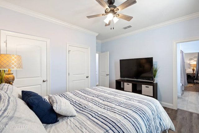 bedroom featuring ceiling fan, ornamental molding, and wood-type flooring